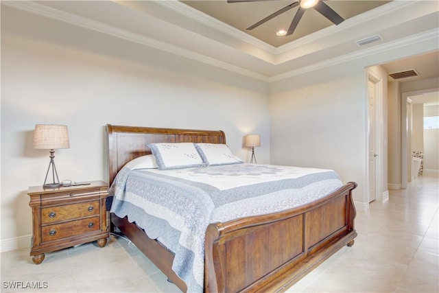 bedroom featuring light tile patterned floors, a tray ceiling, ornamental molding, and ceiling fan