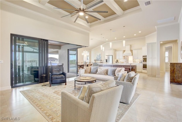 tiled living room with an inviting chandelier, a towering ceiling, beam ceiling, coffered ceiling, and ornamental molding