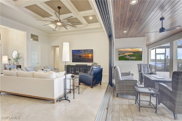 living room featuring coffered ceiling, crown molding, beam ceiling, and ceiling fan