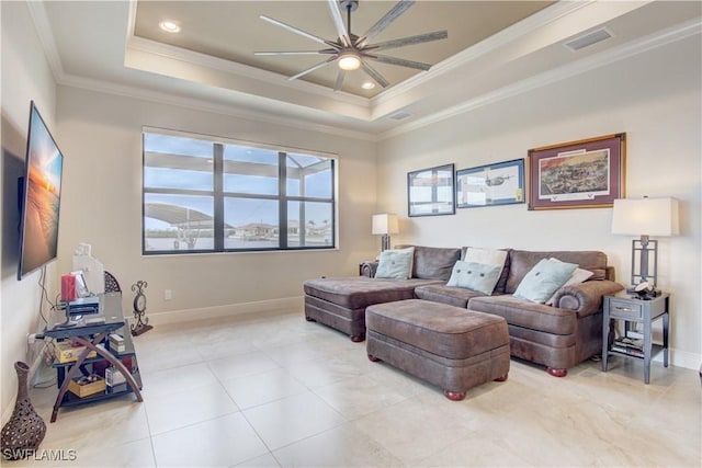 living room featuring crown molding, a tray ceiling, and ceiling fan