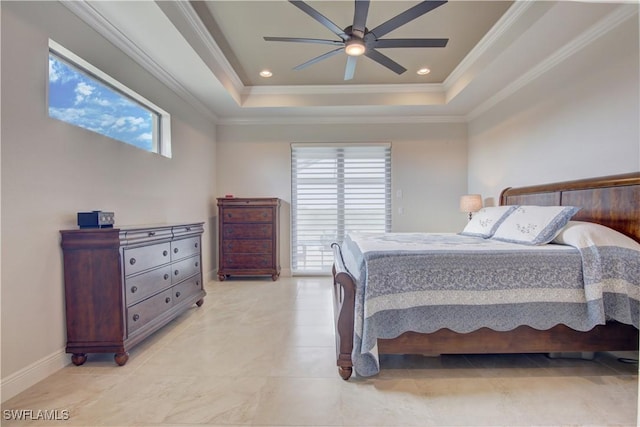 bedroom with ceiling fan, a tray ceiling, and multiple windows