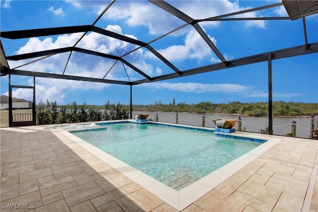 view of swimming pool with pool water feature, a water view, a patio area, and glass enclosure