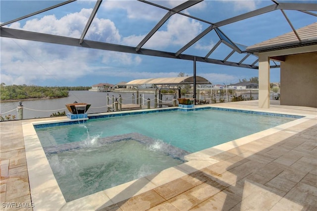 view of swimming pool featuring a patio, a lanai, a dock, and pool water feature