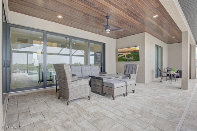 view of patio with an outdoor hangout area and ceiling fan