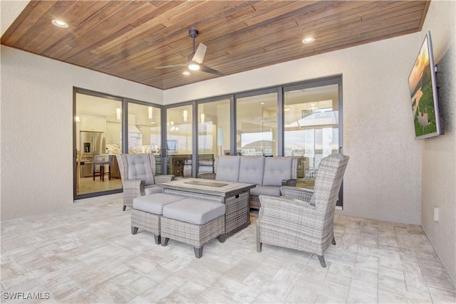 view of patio featuring an outdoor hangout area and ceiling fan