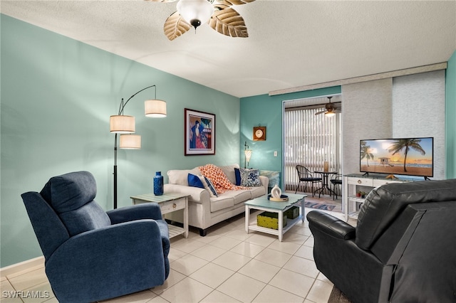 tiled living room with a textured ceiling and ceiling fan