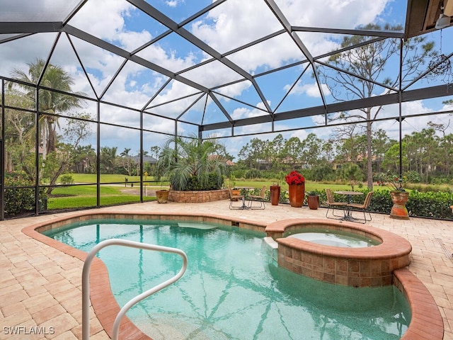 view of pool with an in ground hot tub, a lanai, and a patio