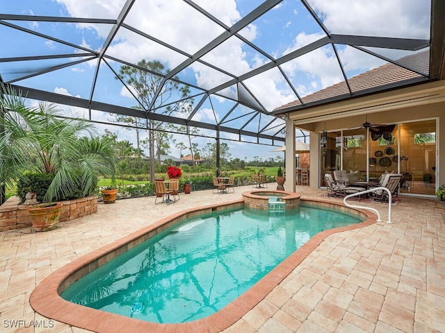 view of swimming pool featuring a lanai, a patio, ceiling fan, and an in ground hot tub