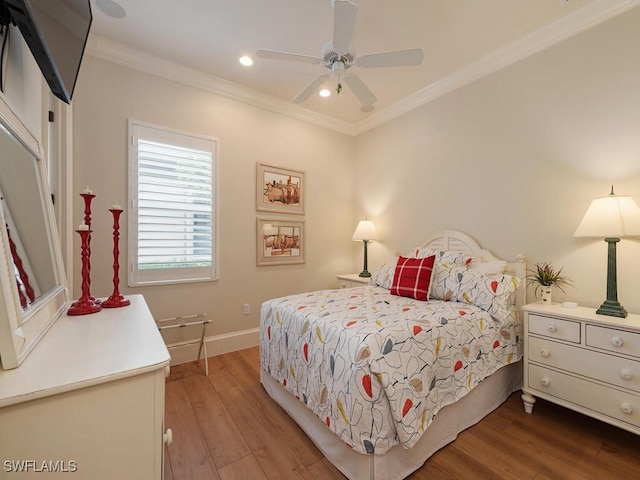 bedroom featuring crown molding, ceiling fan, and wood-type flooring