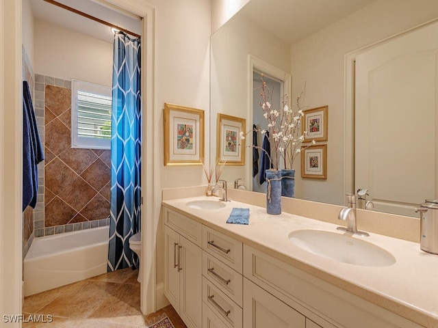 full bathroom with vanity, toilet, and shower / bath combo with shower curtain