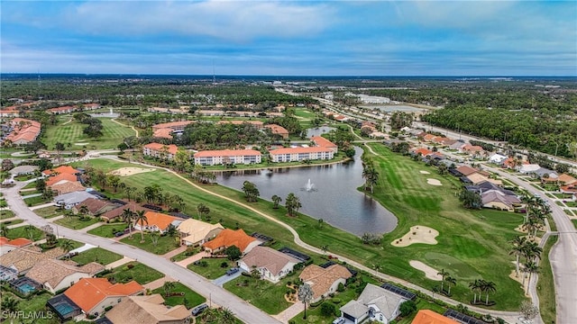 aerial view with a water view, view of golf course, and a residential view