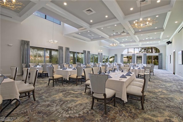 dining room with a notable chandelier, dark colored carpet, visible vents, a towering ceiling, and coffered ceiling