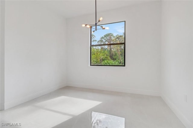 empty room with an inviting chandelier