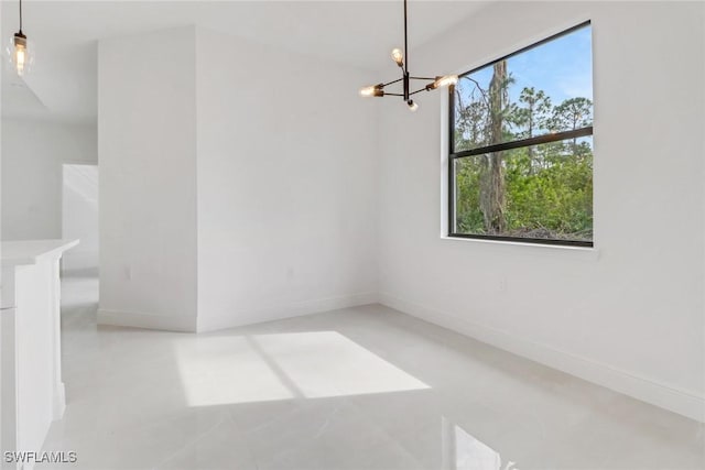 empty room with a notable chandelier