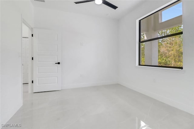 unfurnished room with ceiling fan