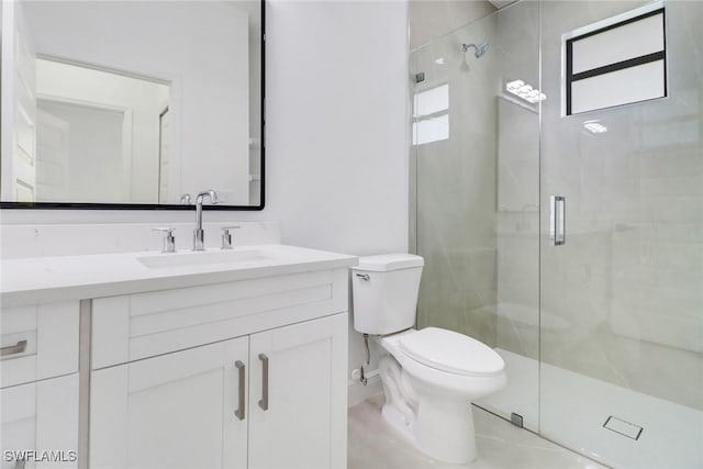 bathroom featuring walk in shower, vanity, and toilet