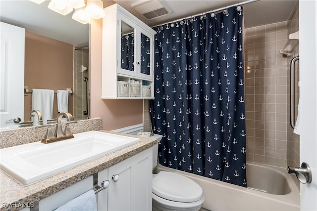 full bathroom featuring vanity, toilet, and shower / tub combo