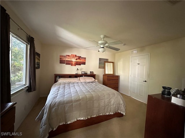 bedroom with ceiling fan and carpet