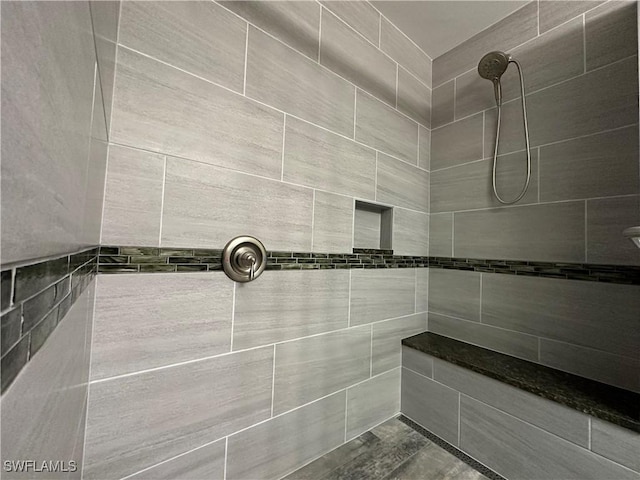 bathroom featuring tiled shower