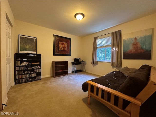 bedroom featuring light carpet