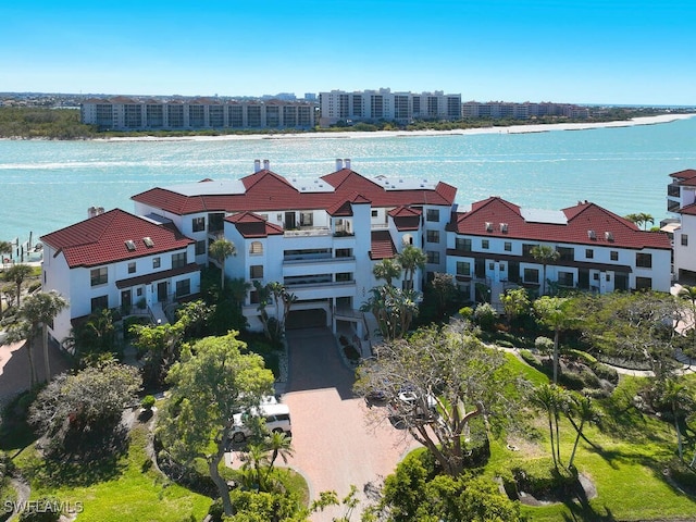 birds eye view of property featuring a water view