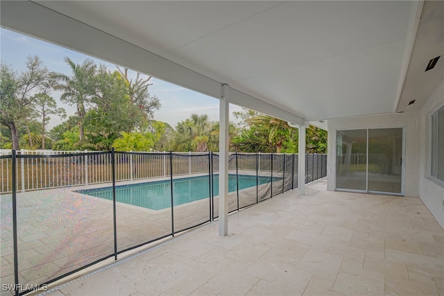 view of swimming pool featuring a patio area