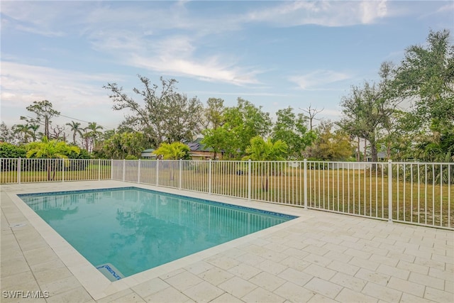 view of swimming pool with a patio area, a fenced backyard, and a fenced in pool