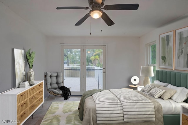 bedroom featuring ceiling fan and access to exterior