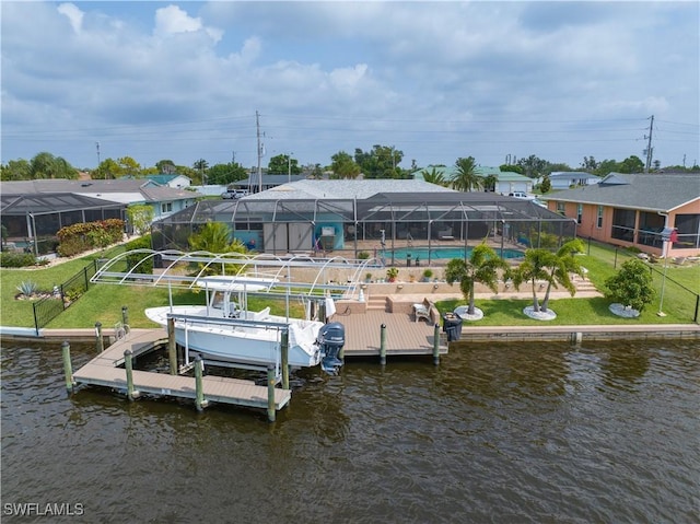 dock area featuring a water view, a lanai, and a lawn