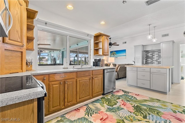 kitchen featuring sink, ceiling fan, hanging light fixtures, range with electric cooktop, and stainless steel dishwasher