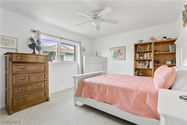 bedroom featuring light carpet and ceiling fan