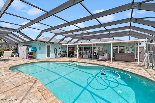 view of pool with a patio and a lanai