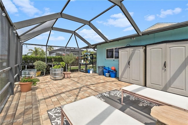 view of patio / terrace featuring a lanai