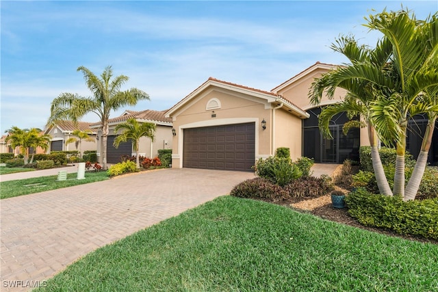 view of front of home featuring a garage and a front yard