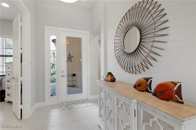 entryway with light tile patterned floors