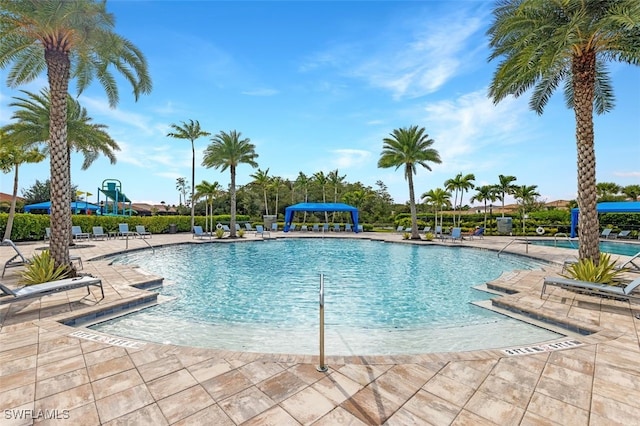 view of swimming pool featuring a patio area