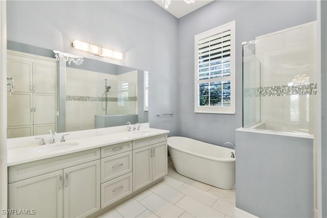 bathroom with vanity, shower with separate bathtub, and tile patterned flooring