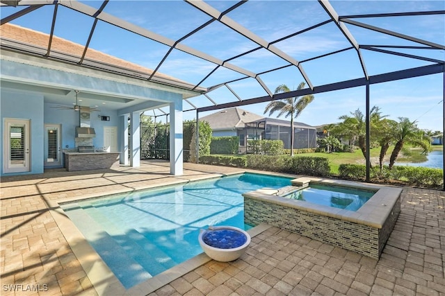 view of pool featuring a patio, ceiling fan, an in ground hot tub, and a lanai