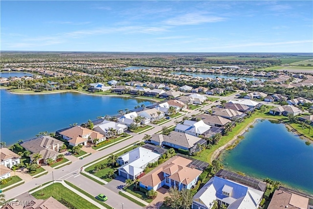 bird's eye view with a water view