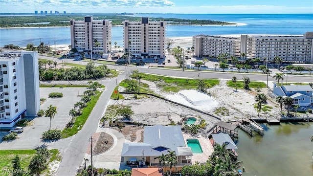 birds eye view of property with a water view