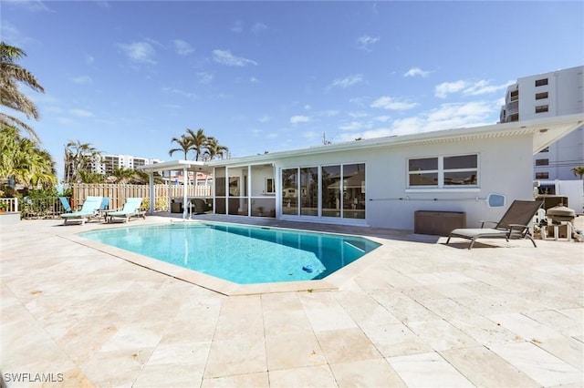 view of pool with fence, a fenced in pool, and a patio