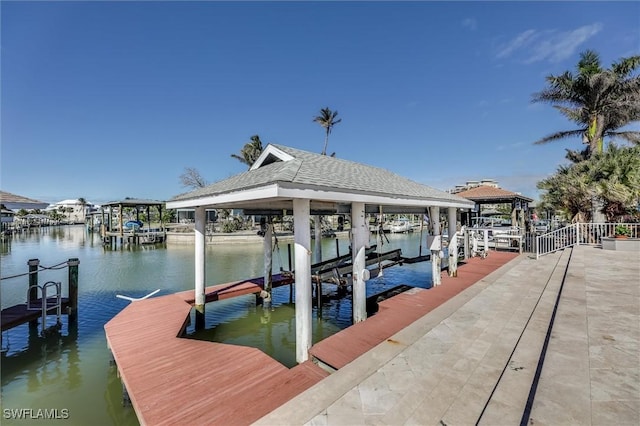 view of dock featuring a water view and boat lift