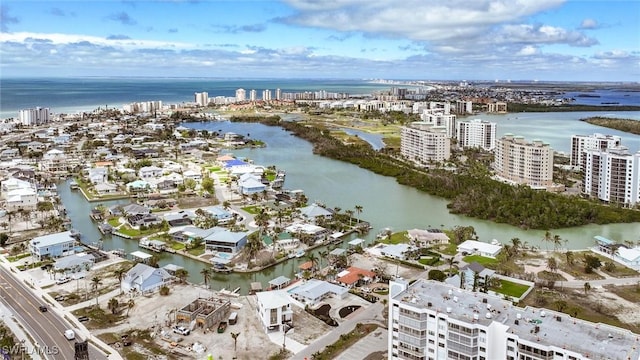 bird's eye view featuring a water view and a view of city