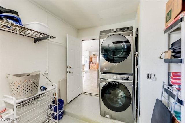 laundry area featuring laundry area and stacked washer / drying machine