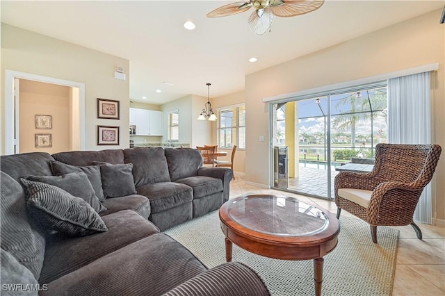 tiled living room with ceiling fan