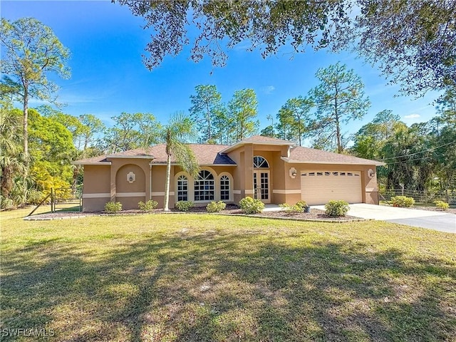 view of front facade with a garage and a front lawn