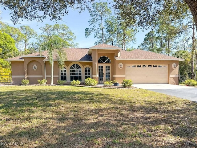 2910 2nd St NE, Naples, FL 34120 - view of front of house featuring french doors, stucco siding, and an attached garage