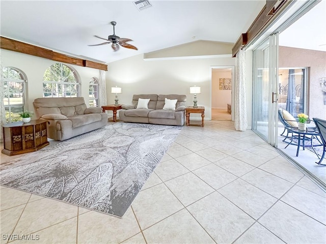 living room with light tile patterned flooring, ceiling fan, and lofted ceiling