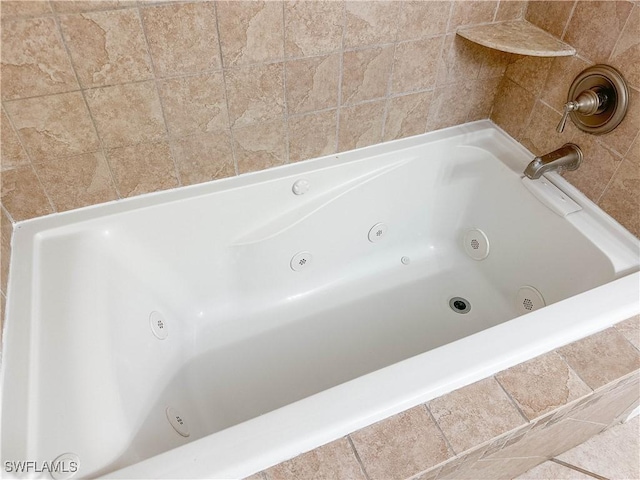 2910 2nd St NE, Naples, FL 34120 - bathroom with a tub with jets