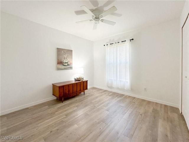 2910 2nd St NE, Naples, FL 34120 - spare room featuring light wood finished floors, a ceiling fan, and baseboards